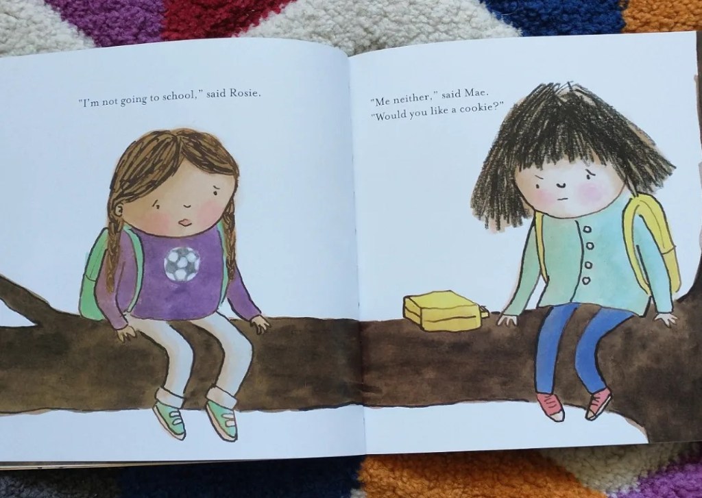 Two little girls sit on a tree branch, they are frightened about starting school, one offers the other a cookie